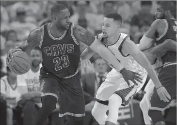  ?? The Associated Press ?? SAME TIME THIS YEAR: LeBron James (23) and the Cleveland Cavaliers face Stephen Curry and the Golden State Warriors in the NBA Finals for the third-straight year in a best-of-seven series starting Thursday night in Oakland, Calif. Golden State won the...