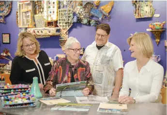  ?? ?? Margo Ashmore with fellow Northeast Minneapoli­s Arts District board members: (l to r) Sue Sjoselius, Margo Ashmore, Josh Blanc, Kristine Martin. They are in the studio of polymer clay artist Layl Mcdill at Clay Squared to Infinity. Margo’s work with the Arts District is only one of the ways she has impacted her community and informed her work at the Northeaste­r.