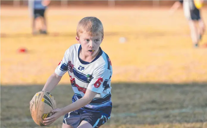  ?? Picture: Kevin Farmer ?? TEAM PLAYER: Cooper James loves playing rugby league with his Brothers under-8s teammates.