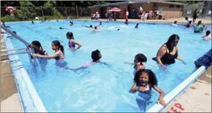  ?? RECORD FILE PHOTO ?? Swimmers take to the water of the municipal pool in South Troy in this photo from June 2014.