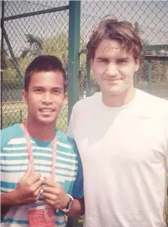  ?? Supplied Photo ?? CAGAYAN de Oro’s own tennis hero, Francis Casey Alcantara gets the chance to have a picture take with his idol `The Goat’ Federer.