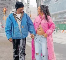  ?? ?? A$AP Rocky and Rihanna strolling through Harlem, NY. The singer is wearing vintage Chanel from the Autumn/Winter 1996 collection. | MILES DIGGS Diggzy