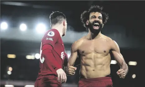  ?? PETER BYRNE/PA VIA AP ?? Liverpool’s Mohamed Salah celebrates after scoring his side’s sixth goal during the English Premier League soccer match between Liverpool and Manchester United at Anfield in Liverpool, England, on Sunday.