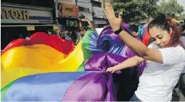  ?? AP ?? Gay-rights activists celebrate after India's top court struck down a law that made homosexual acts punishable by up to 10 years in prison.