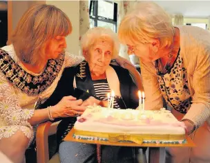 ??  ?? ●●Resident Lily Gray (centre) celebratin­g her 100th birthday with Stockport Mayor Linda Holt left, and daughter Norma Bird.
