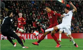  ??  ?? Alisson Becker and Virgil van Dijk combine to keep West Ham’s Pablo Fornals at bay. Photograph: Jason Cairnduff/Action Images via Reuters