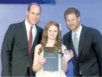  ?? PAUL GROVER/THE ASSOCIATED PRESS ?? Prince Harry, right, and Prince William give The Diana Award to Cuddles for Cancer founder Faith Dickinson, of Peterborou­gh, during a ceremony for the inaugural legacy award program for internatio­nal youths at St. James Palace in London on Thursday....