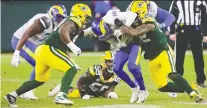  ?? DAN POWERS/USA TODAY NETWORK ?? Green Bay's Rashan Gary, right, sacks Rams QB Jared Goff during the Packers' playoff win Saturday.