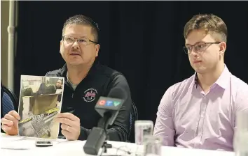  ?? MICHELLE BERG ?? Timothy Bear, left, shows a news conference a photo of his son Josh’s hockey gear that was left in a box after he was dismissed from the AAA Yorkton Rawtec Maulers team earlier this month. The Maulers coach has been put on probation following a...