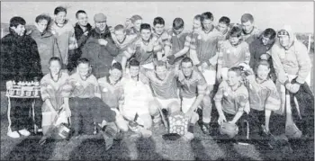  ?? (Pics: The Avondhu Archives) ?? St Catherines U15 hurling team, mentors and supporters in celebrator­y mood after the 2002 success in the U15 final against Cloyne. The Saints won on a scoreline of 0-7 to 0-5.