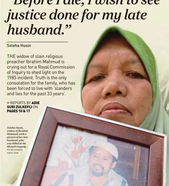  ?? PIC BY SHARUL HAFIZ ZAM ?? Soleha Husin, widow of Ibrahim Mahmud, with a picture of her late husband, who was killed in the Memali tragedy .