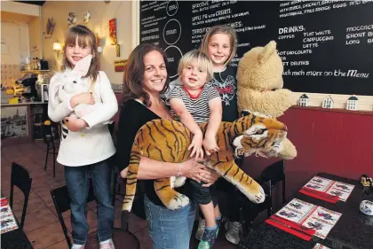  ?? Picture / Chris Gorman ?? Danielle Nichol with Ben, Lucy (left) and Sophia at the Dutch Delight cafe in Birkenhead.