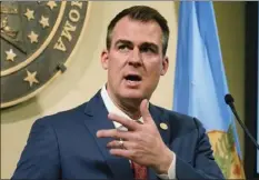  ?? AP PHOTO/SUE OGROCKI ?? In this Feb. 11 file photo, Oklahoma Gov. Kevin Stitt speaks during a news conference in Oklahoma City. Gov. Stitt is signing three anti-abortion bills into law. Stitt announced on Twitter Monday, that he’d signed bills requiring physicians who perform abortions to be certified in obstetrics, adding performing abortions to the list of unprofessi­onal conduct by doctors and prohibitin­g abortions of a fetal heartbeat is detected.