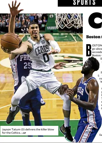  ?? —AP ?? Jayson Tatum (0) delivers the killer blow for the Celtics.