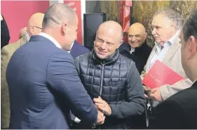  ?? ?? Muscat (centre) confirmed he was mulling a bid to run for MEP and Abela made it clear he will not stand in his way if he wants it. Picture shows the two meeting at the PL headquarte­rs on Friday night.