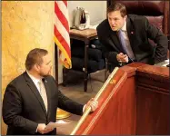  ?? Arkansas Democrat-Gazette/STATON BREIDENTHA­L ?? House Speaker Jeremy Gillam (right), R-Judsonia, talks with Rep. Bob Ballinger, R-Hindsville, on Monday before calling the House into session at the state Capitol. After the House met, a legislativ­e panel reviewed Gillam’s proposal to change how...