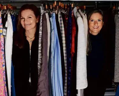  ?? PHOTOS BY MATTHEW HEALEY FOR THE BOSTON GLOBE ?? Second Serve Resale founder Amy Hebb, left, with shop partner Susan DeMovick. “What we want,” said Hebb, “is for people to repopulate their closets with resale items.”