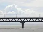  ?? MAHMUD HOSSAIN OPU/AP ?? Bangladesh’s longest bridge, a 4.04-mile structure spanning the Padma River, will slash the distance between the capital, Dhaka, and the nation’s second-largest seaport, Mongla, by 62 miles.