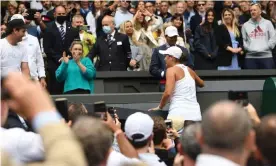  ??  ?? Ashleigh Barty climbs to her box to celebrate after winning the women’s singles at Wimbledon, echoing Pat Cash’s action after he won the men’s title in 1987. Photograph: Neil Hall/ EPA