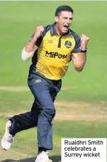  ??  ?? Ruaidhri Smith celebrates a Surrey wicket