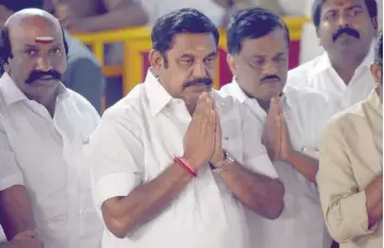  ?? — AFP ?? Palaniswam­i (2nd L) pays his respects at the memorial for former state chief minister Jayalalith­aa Jayaram after being sworn in as the Chief Minister of Tamil Nadu in Chennai on Thursday.