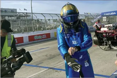  ?? JENNA FRYER — THE ASSOCIATED PRESS ?? Jimmie Johnson prepares for practice at the Grand Prix of Long Beach, Calif., on Saturday. Johnson fractured his hand in a crash on Friday and was fitted with a carbon fiber splint that he tested in Saturday practice.