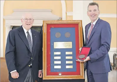  ?? 46#.*55&% ?? The prestigiou­s Arthur L. Irving Medal of Commitment has been awarded to Ray Ivany. The presentati­on was made by Arthur Irving during a ceremony on June 26.