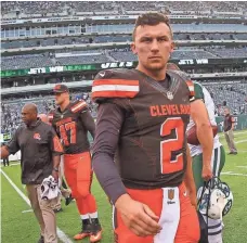  ?? ED MULHOLLAND, USA TODAY SPORTS ?? Johnny Manziel’s latest off-field episode included police saying his girlfriend told them, “He hit me a couple of times.”