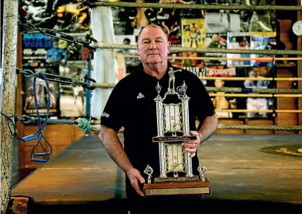  ?? PHOTO: WARWICK SMITH/STUFF ?? Palmerston North’s Billy Meehan shows off the Brian O’brien Trophy he was awarded for outstandin­g service to New Zealand boxing.