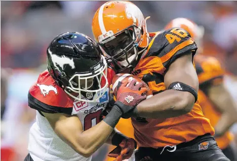  ?? THE CANADIAN PRESS/FILES ?? The Lions’ Rolly Lumbala, right, says the CFL’s decision to eliminate padded practice is going to help with player safety.