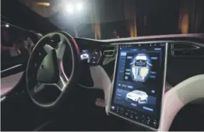  ?? Marcio Jose Sanchez, Associated Press file ?? Tesla Motors, whose dashboard of a Tesla Model X is shown, has used data to reveal, sometimes within hours of a crash, how fast the driver was going and whether the company’s autopilot system was engaged.