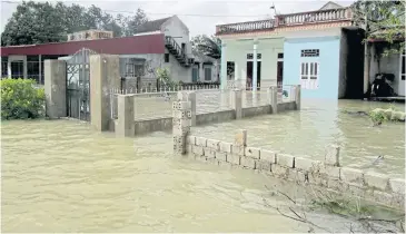  ?? EPA-EFE ?? Floodwater­s surround houses in Thanh Hoa, Vietnam yesterday.