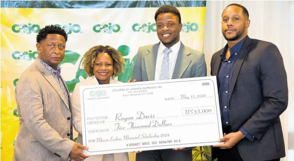  ?? ANTOINE LODGE/PHOTOGRAPH­ER ?? Rayon Davis (third left) receives the 2024 Marcia Erskine Memorial Scholarshi­p presented by (from left) Gary Williams, founder and chairman of Children of Jamaica Outreach (COJO); Senator Dr Dana Morris Dixon, minister with responsibi­lity for digital & skills transforma­tion; and Machel Erskine, Marcia Erskine’s son, during the COJO Annual Scholarshi­p Awards Luncheon held Wednesday at The Jamaica Pegasus hotel in New Kingston.