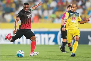  ?? Courtesy: Al Ahli Twitter ?? Ahmad Khalil of Al Ahli in action against Al Taawoun of Saudi Arabia. Al Ahli took an important step towards qualifying for the second round of the Asian Champions League with the 3-1 win.