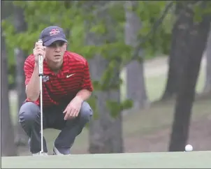  ?? The Sentinel-Record/Richard Rasmussen ?? NICK OF TIME: Henderson State sophomore Nick Shapiro eyes a putt on the second hole of the Arlington Course at Hot Springs Country Club Monday during the second round of the GAC Golf Championsh­ips.