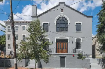  ??  ?? The exterior of these new luxury condos channel the building’s original use — as a Baptist church.