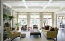  ?? ANGIE SECKINGER — MARIKA MEYER INTERIORS VIA AP ?? As 2019 approaches, Washington D.C.-based interior designer Marika Meyer sees a trend toward warm neutral colors and antique furniture in warm wood tones, as seen in this living room designed by Meyer.