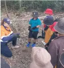  ?? ?? Image: Students planting trees for the combined Schools Tree Planting Day on the foreshore of the Lucinda Port.