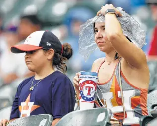  ?? Tony Gutierrez / Associated Press ?? Dreary weather in Arlington didn’t stop Astros fans from making their presence felt last weekend, with Bill Brown calling it “very noticeable.”