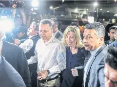  ??  ?? GOING BACK HOME: US pastor Andrew Craig Brunson, centre left, arrives at Adnan Menderes airport in Izmir yesterday en-route to the United States.