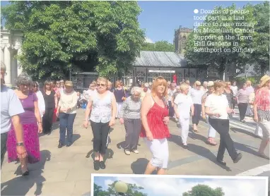  ??  ?? Dozens of people took part in a line dance to raise money for Macmillan Cancer Support at the Town Hall Gardens in Southport on Sunday