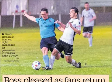  ?? FJA PHOTOGRAPH­Y ?? Fisnik Hajdari of Widnes, right, challenges for possession in Tuesday night’s derby