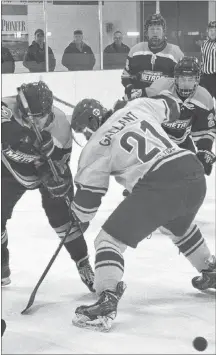  ?? JASON SIMMONDS/JOURNAL PIONEER ?? Western Red Wings captain Chasse Gallant and the Sherwood-Parkdale Metros’ Barrington Duffy battle for possession of the puck off a faceoff during Game 3 of the Island Junior Hockey League championsh­ip series at the Evangeline Recreation Centre in April.