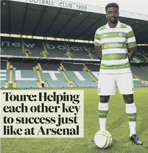  ??  ?? 0 Kolo Toure dons his new colours at Parkhead yesterday. Below, former Liverpool team-mate Luis Suarez.