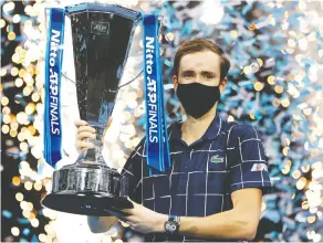  ?? Clive Brunskil / Gett y Imag es ?? Daniil Medvedev came from behind to defeat Dominic Thiem on
Sunday in the ATP Finals at London’s O2 Arena.