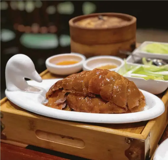  ?? Photos by Mai Pham / Contributo­r ?? Bamboo House’s presentati­on of Peking duck, with its delicate, delectable skin, is something to behold.