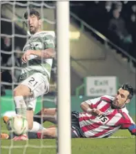  ?? PA. ?? Charlie Mulgrew slides in Celtic’s third goal.