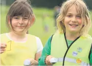  ??  ?? Balamcing act Bethany Jones and Edith Stirling who were first and second in the P3/4 potato and spoon race