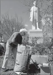  ?? SARAH GORDON/THE DAY ?? Volunteer Sue Davis, with the New London Beautifica­tion Committee, works on cleaning up the garden at Columbus Circle on April 18, 2017, in New London. The committee is made up of 18 members who take care of parks all over the city.