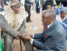 ??  ?? Vice-President Cde Kembo Mohadi (right) greets Chief Vezi Maduna of Insiza District during the launch of the National Culture Week at Bolamba Cultural Centre at Gungwe in Gwanda South District yesterday. (See story on Page 6)